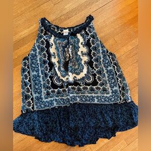 Shades of blue tank top with tie key hole accent in front.